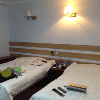 My electronics are laid out on two single beds.