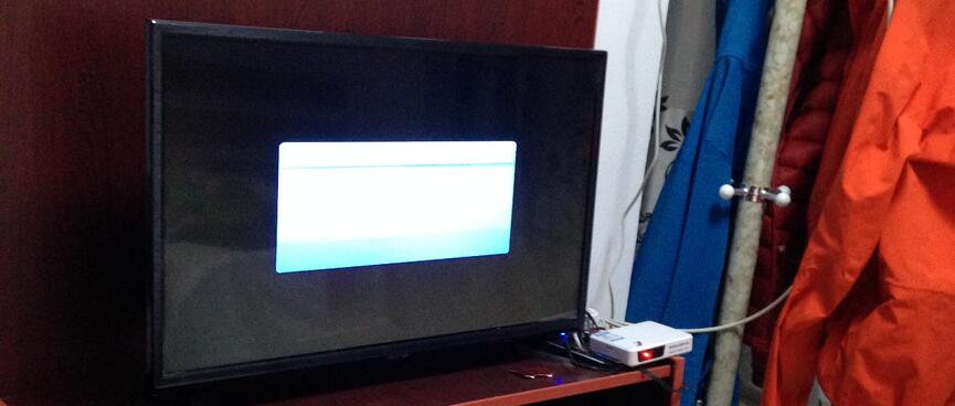 An informational box on a black TV screen.