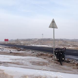 Low hills, snow and mud.