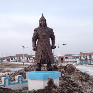 A metal soldier stands guard outside the exhibits.