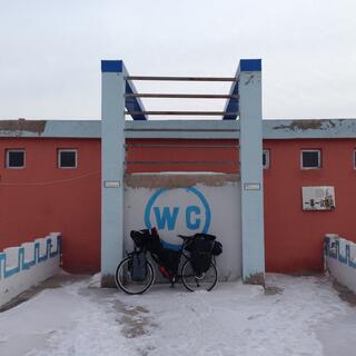 Blue lettering reading WC.