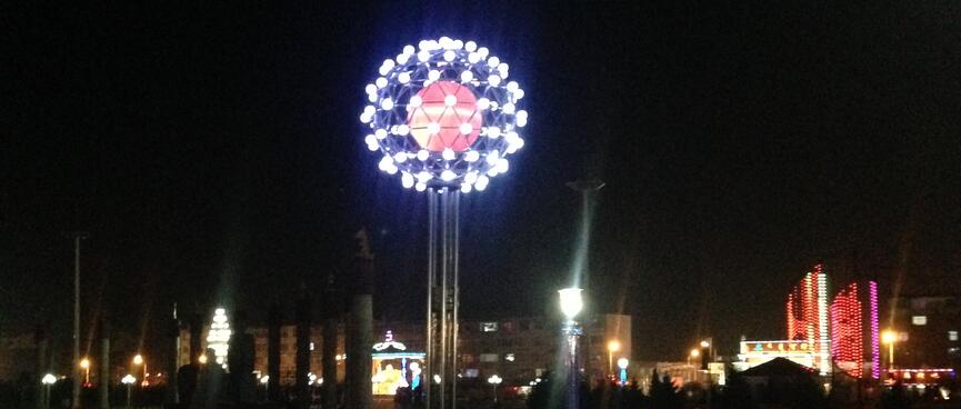 Dome with a red center surrounded by white lights.