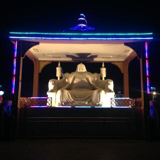 Statue of Genghis Khan seated on a throne.