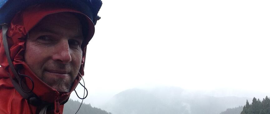 I grimace in the Japanese rain.