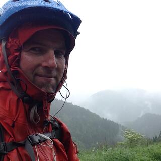 I grimace in the Japanese rain.
