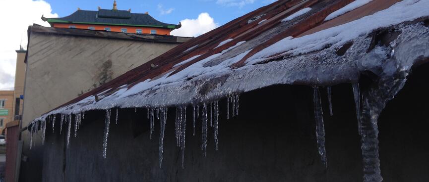 Stalactites hang from a tin roof.