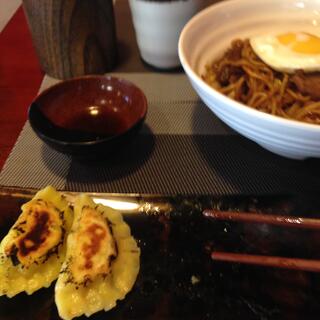 Bowls and trays of Japanese food.