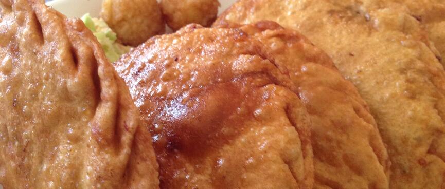 Deep fried half rounds of pastry.