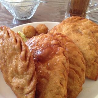 Deep fried half rounds of pastry.