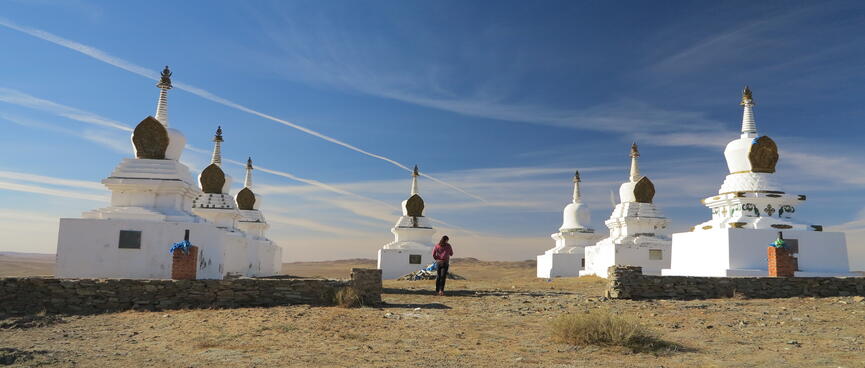 Squat white stone monuments topped with pointed domes.