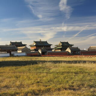 A walled area containing two story buildings with smiling eaves.