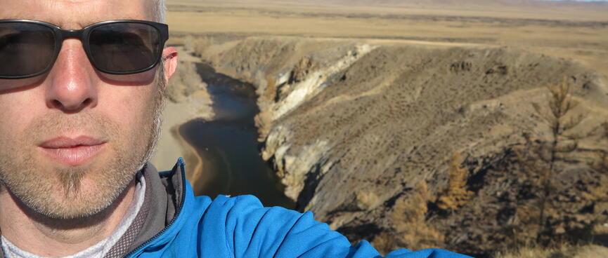 A photo of me with the river in the background.