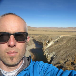 A photo of me with the river in the background.