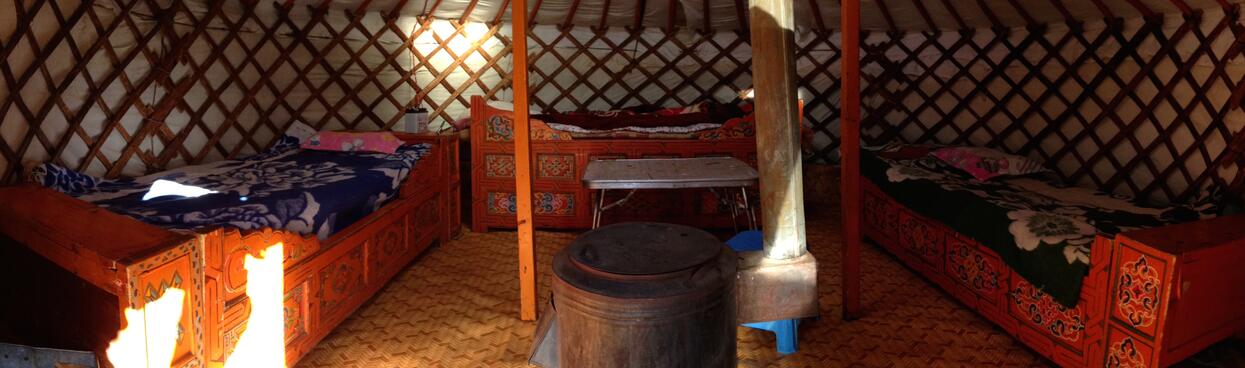 Floral bedspreads on top of ornate wooden bed frames.