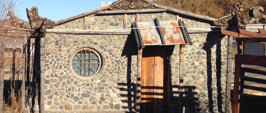 A stone building and two hot pools.
