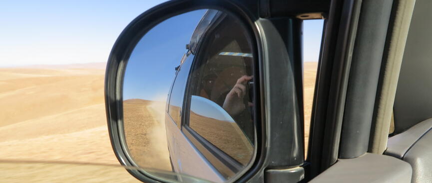 Reflections in the vanʼs wing mirror.