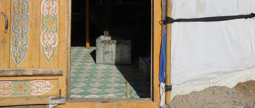 The ornate door of our ger is wide open.