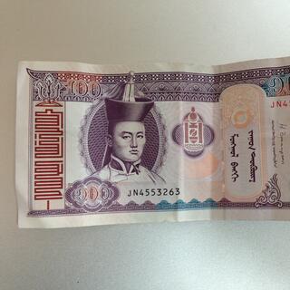 The face of Damdin Sükhbaatar, on the front of a 100 Tugrik bill.