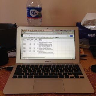 A spreadsheet of timesheet entries on the screen of my MacBook Air.