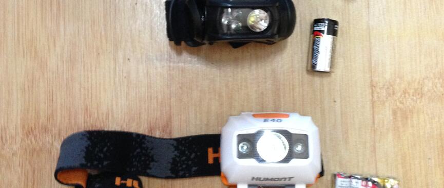 Three head torches and their batteries.