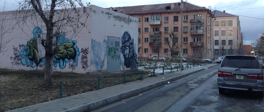 The N word is amongst graffiti on an industrial building.