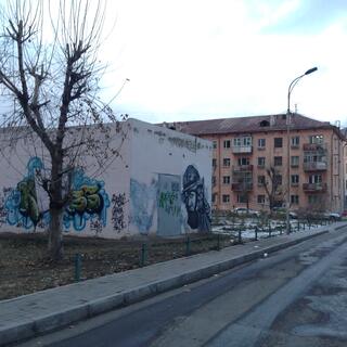 The N word is amongst graffiti on an industrial building.
