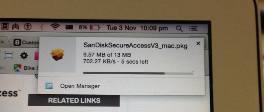 Downloading a file at 702.27 KB/s.