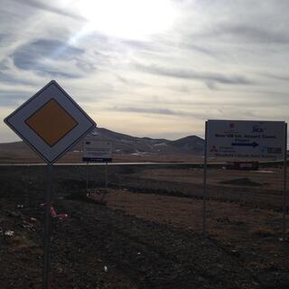 A sign for the New UB Int Airport Const Project, a Mitsubishi-Chiyoda Joint Venture.