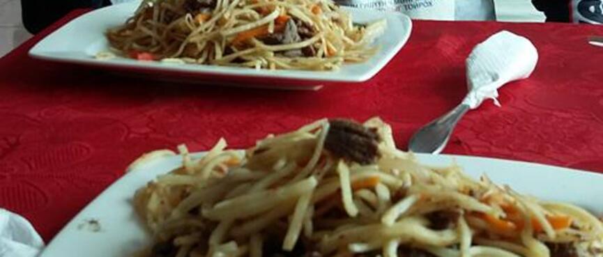 Two plates of noodles.