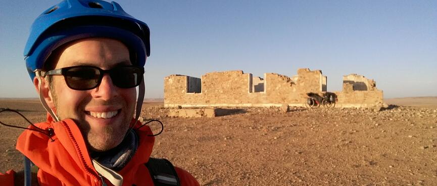 Smiling selfie with the roofless building.