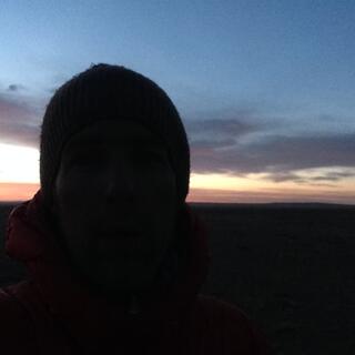 My beanie covered head cuts a sillouhete in the pre-sunrise.