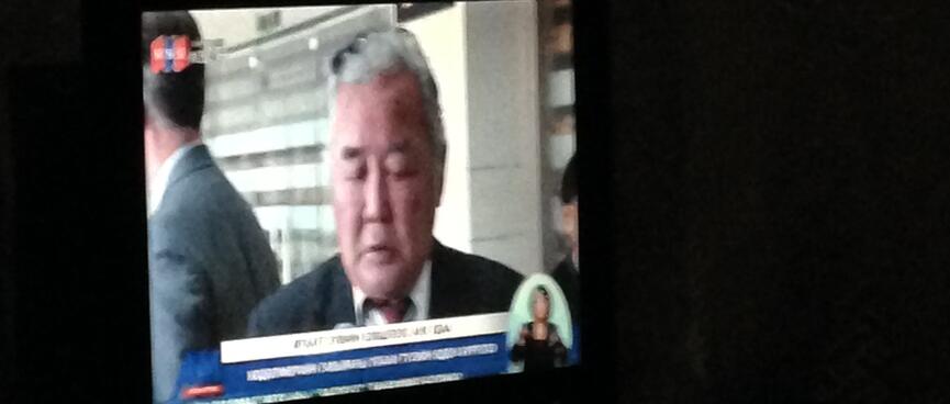 A suited gentleman on the television.