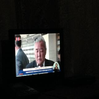 A suited gentleman on the television.