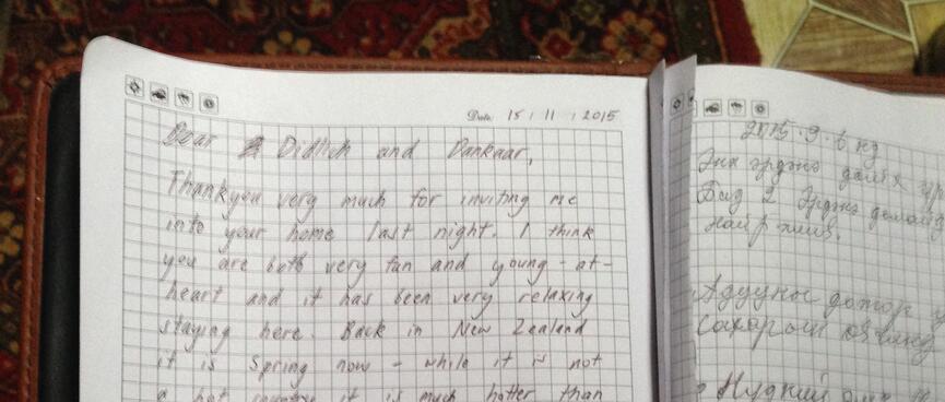 English and Mongolian entries on adjacent diary pages.