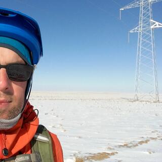 I pose with one of the ubiquitous power pylons.