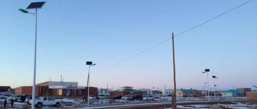 Each streetlight is powered by a solar panel mounted above it.
