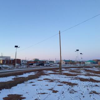 Each streetlight is powered by a solar panel mounted above it.
