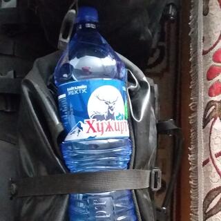 A blue 1.5L water bottle branded with a reindeer.