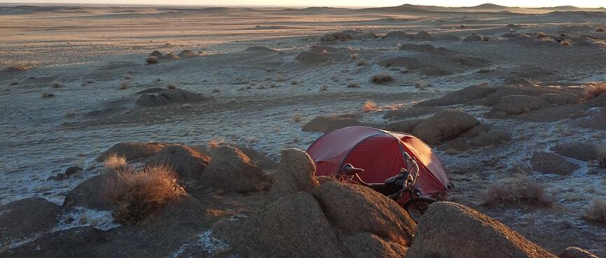 My tent is sits behind a pile of small boulders.