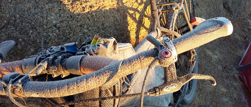 A thick coating of frost on my bikeʼs loop handlebars.