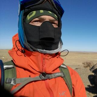Wearing a balaclava, beanie, hoody, goggles and a jacket, I squint my eyes and stare into the distance.