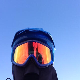 Close up of my head, which is covered in my POC helmet and orange mirrored goggles.