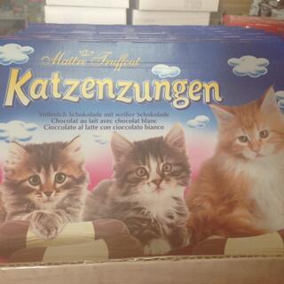 Three kittens on a box of Katzenzungen milk chocolates.