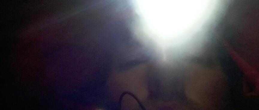 I exhale a cloud of steam in a dark tent lit only by my head torch.