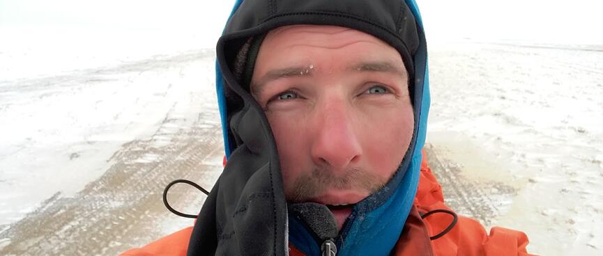 My unfastened balaclava reveals a red nose and red cheeks.