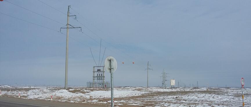 Power pylons extend into the distance.