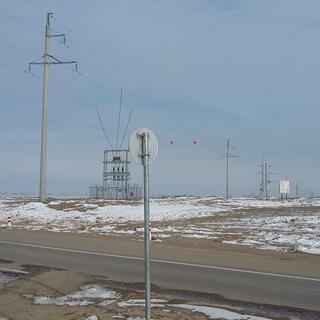 Power pylons extend into the distance.