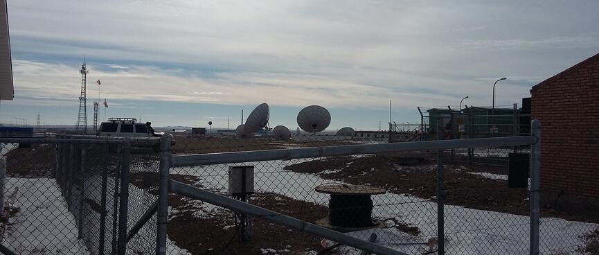 Two large satellite dishes and and three smaller ones.