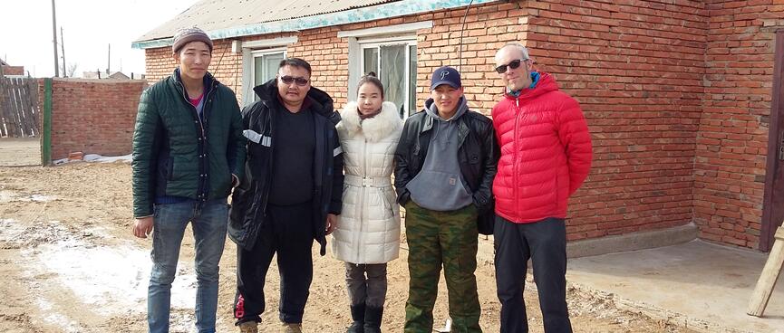 Group photo with a tall man, our driver, the woman in the white coat, Tommy and I.