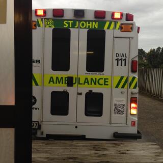 I lie in the back of a St John's ambulance.